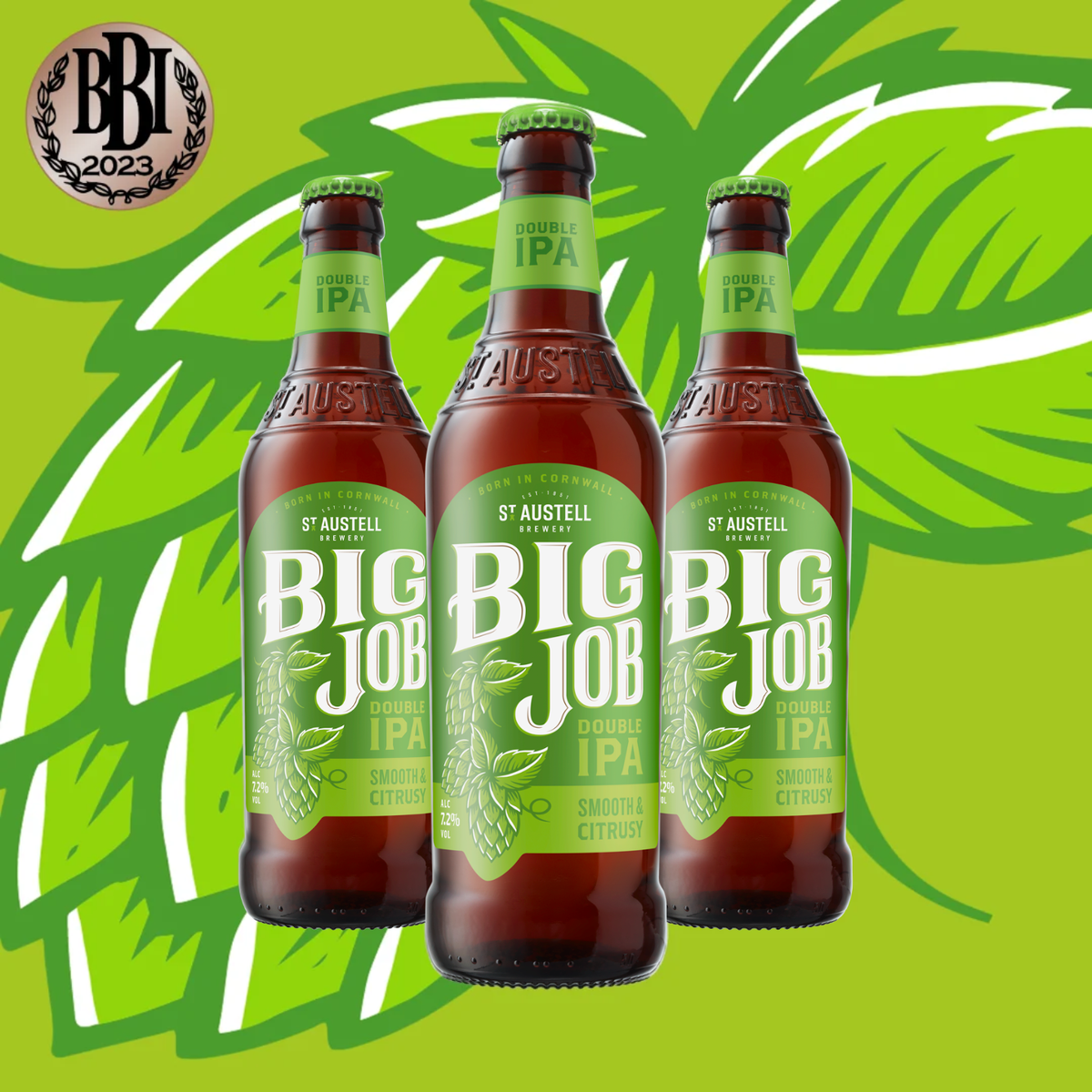 Three brown glass bottles of St. Austell Big Job Double IPA beer with green labels, arranged against a bright green background with white and green hops graphics.